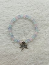 Pastel pink, purple, and blue glass bead bracelet with a dragonfly charm. - $7.00