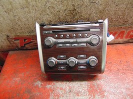 16 15 14 13 Nissan Pathfinder oem cd player radio & climate control switch unit - $49.49