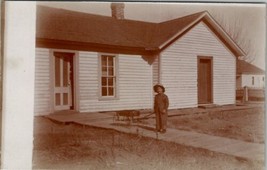 Young Boy with Wagon Woodne Sidewalks Woman Peeking out Door Postcard U3 - $9.95