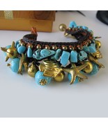 EleganceWithFlair Turquoise Chips Howlite with brass bells and sea creat... - $473.21 MXN