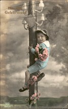 Vintage boy electricity pole, Art Deco tinted postcard, circa 1920, vintage - $92.48 MXN