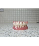Full upper and lower dentures/false teeth, Brand new. - $135.00