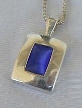 Mini blue cat eye pendant - $25.00