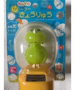 Swinging Solar Dinosaur - $487.71 MXN