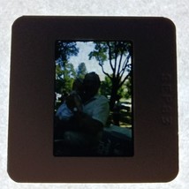 Found 35mm Slide Grandpa and Baby 1983 Park Ash Trees Photo OOAK - $8.49