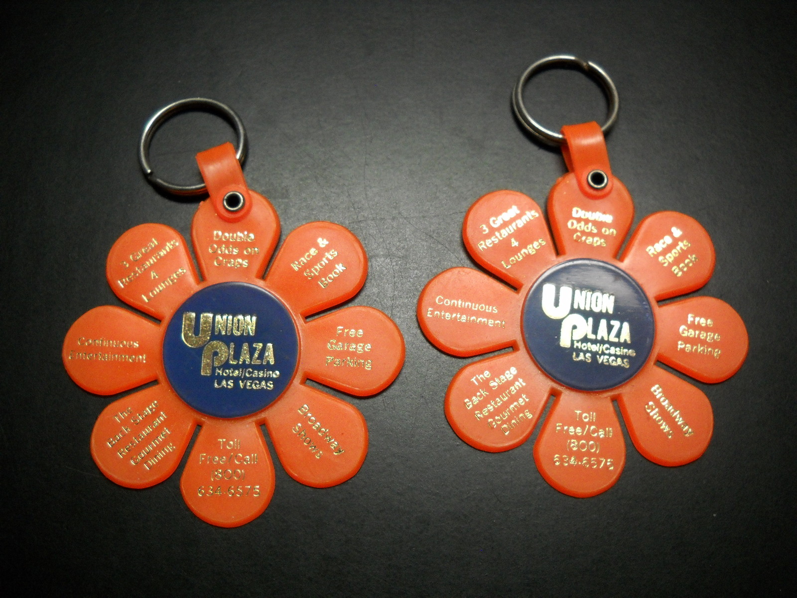 Union Plaza Hotel Casino Las Vegas Key Chain Set of Two Orange Flower Blooms - $6.99