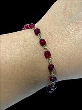 signed NR faux garnet with cross. harm bracelet 6.5” - $10.80