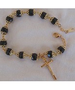 Black glass beads bracelet with golden cross - $27.00