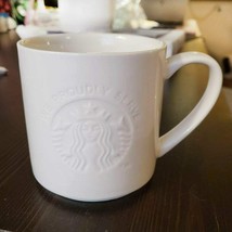 STARBUCKS We Proudly Serve White Embossed Logo Coffee Mug Cup 12 oz - $18.80