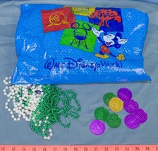 Lot of Vintage Disney Pleasure Island Mardi Gras Coins Token Beads &amp; Bag... - $40.45