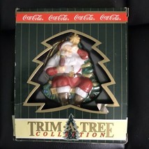 Coca Cola Trim a Tree Santa Drinking Coke in Front of Christmas Tree Orn... - $14.03
