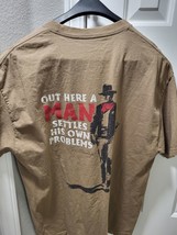 John Wayne Men&#39;s T Shirt Out Here A Man Takes Care Of His Own Problems - $17.49