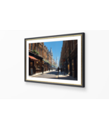 Photograph of a sunlit, cobblestone street in a historic European city  - $45.49 MXN