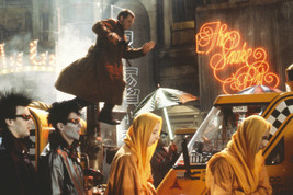 Harrison Ford in Blade Runner Leaping Above Taxis On Street 18x24 Poster - $23.99
