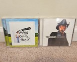 Lot of 2 Tim McGraw CDs: Damn Country Music, Live Like You Were Dying - $8.54
