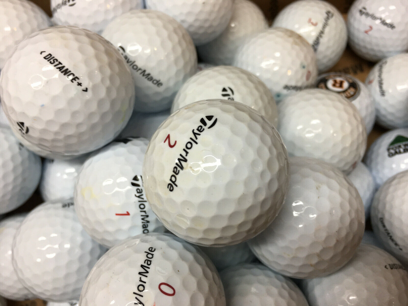 12 Near Mint TaylorMade Distance +  AAAA Golf Balls - $16.40