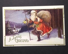 A Joyous Christmas Santa in the Snow w/ Lantern Gold Embossed Postcard c1920s (b - £7.98 GBP