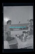 black and white negative - women in the kitchen washing dishes - $8.95