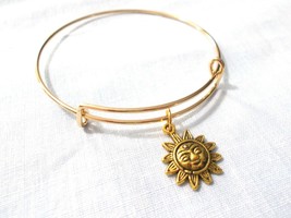 MAYAN SUN GOD DETAILED CHARM ON GOLDTONE ADJUSTABLE BANGLE BRACELET - $5.99
