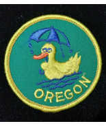 Oregon Duck with umbrella 3&quot; sew-on patch green background - $7.91