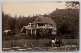 RPPC Lovely Home In Foothills Hotes Team And Child At Picket Fence Postcard L24 - $7.95