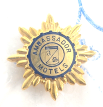 VTG Ambassador Motels Hotel Star Snowflake Gold Tone Lapel Pin Badge Adv... - $16.99