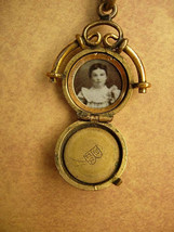 ANtique watch fob locket with little girl photo Flip fob ornate metal work - £88.47 GBP