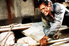 Bruce Campbell in Evil Dead II fighting monster with pick axe 24x18 Poster - £19.29 GBP