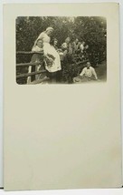RPPC Home Garden Resting on Fence Women with Tongues Out Real Photo Postcard H12 - £10.35 GBP