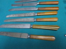 BAKELITE HANDLE, 37 PCS, KNIVES, SPOONS, SERVERS AND FORKS - $2,712.97 MXN