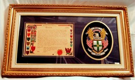 Framed Embroidered Coat of Arms and Family Name History. - $325.00