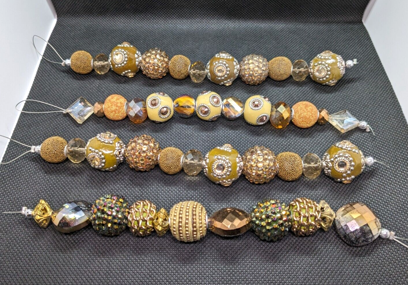Primary image for Lot of Four Bead Strands Ornate Textured Multible Designs Focal Beads Jewelry