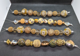 Lot of Four Bead Strands Ornate Textured Multible Designs Focal Beads Jewelry - £12.49 GBP