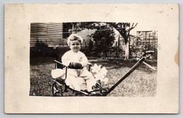 RPPC Young Child In Stroller Buggy Seat Pull Cart with Lily Flowers Postcard T21 - £5.54 GBP