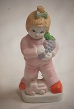 Vintage Bisque Little Girl Figurine w Toy Truck &amp; Bunch Grapes Curio She... - $187.97 MXN