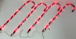 *E) Set of 4 Holiday Candy Cane Light Up Tube Christmas Decoration - $254.88 MXN