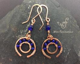 Handmade copper earrings: dangling wagon wheels wire wrapped blue glass beads - £23.12 GBP