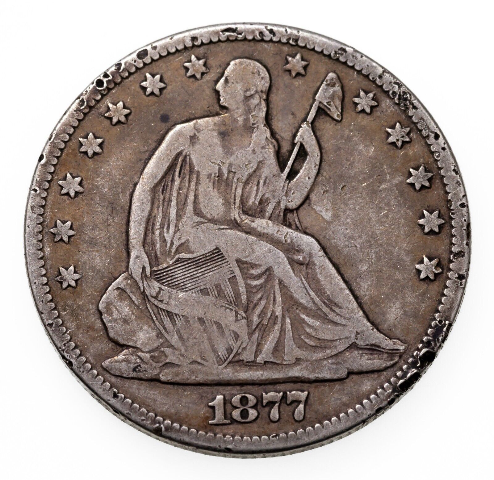 1877-CC 50C Seated Liberty Half Dollar in Good Condition, VG+ in Wear, Rim Ding - $118.80
