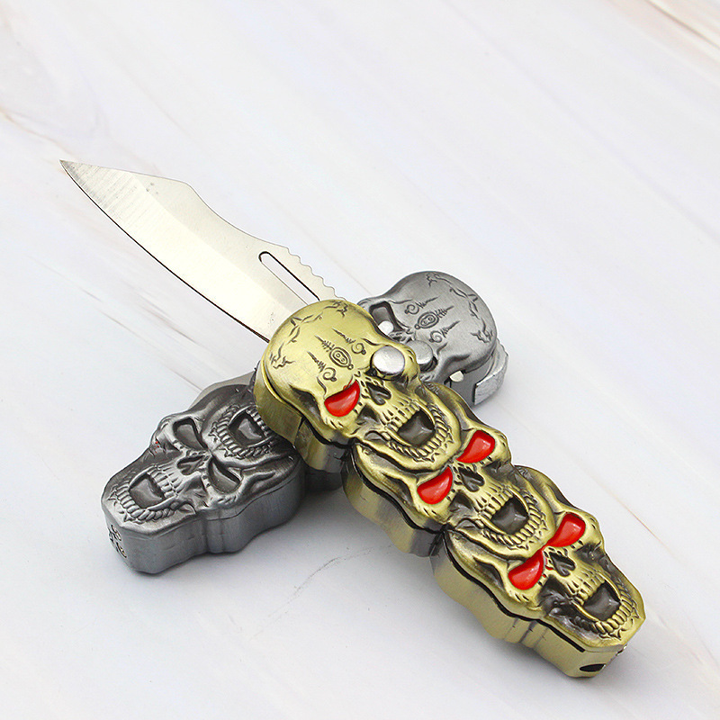 Three Skull Heads Butane Gas Lighter with Clasp Folding Knife Tool (sans... - $17.95