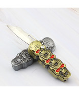 Three Skull Heads Butane Gas Lighter with Clasp Folding Knife Tool (sans... - $24.83 CAD