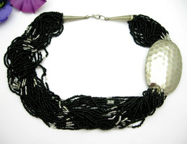 Multi 28 Strand Black Bead Vintage Necklace With Big Hammered Silvertone Oval - £25.80 GBP