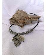Carved Iridescent Black Lip Shell On Leather Cord With Volcanic/Wood Accent Bead - $25.00