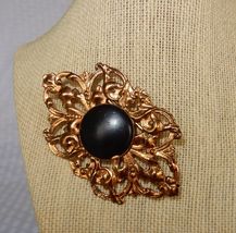 Ornate vtg gold tone &amp; black stone medallion brooch - $12.00