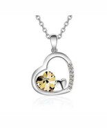 Jeweled Heart Necklace Color: Champagne - $112.71 MXN