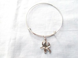 ELEGANT ORCHID OR TIGER LILY FLOWER CHARM ON SILVER ADJUSTABLE BANGLE BR... - $5.99