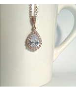 Rose gold plated teardrop cubic zirconia halo necklace with a matching b... - $40.00