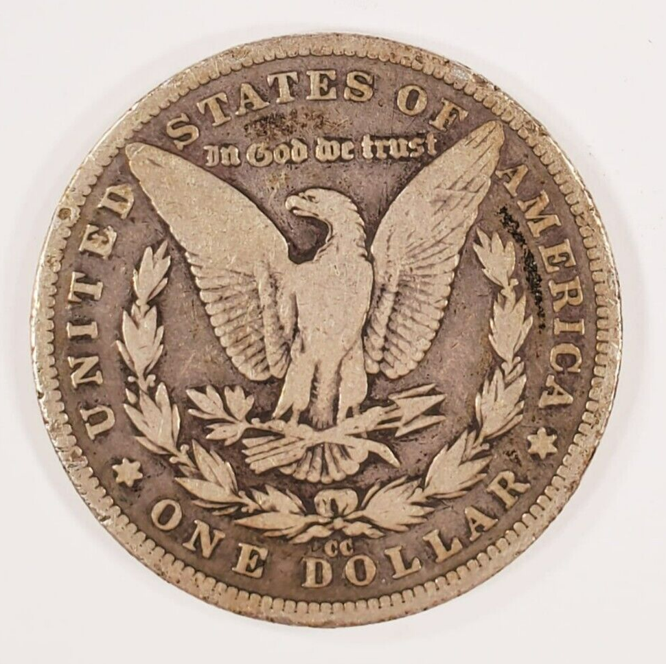 1890-CC Silver Morgan Dollar in Good Condition, VG IN Wear, Minor Rim Damage Item image 2