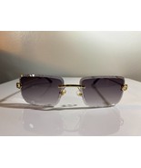 Unisex, rimless, gem cut sunglasses with purple lenses and gold wire frame. - $10.00