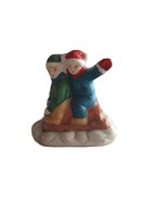 Christmas Village Figurine Boys Sled Green Blue Waving Child Kid Snow Fu... - $184.73 MXN