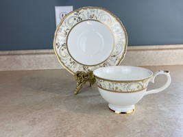 Hampstead Fine Bone China Gold Patterned With Gold Trim Tea Cup and Saucer - $13.85